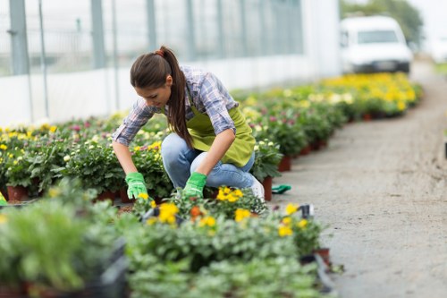 Gardener inspecting insurance documents on clipboard