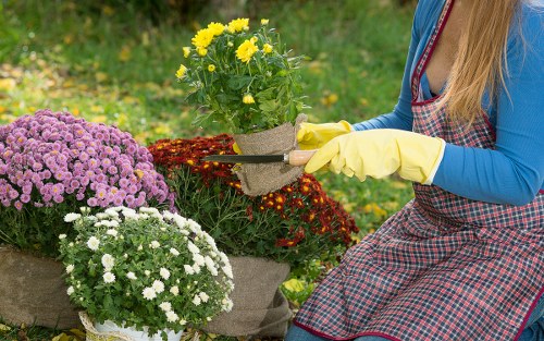 Gardener wearing PPE operating machinery